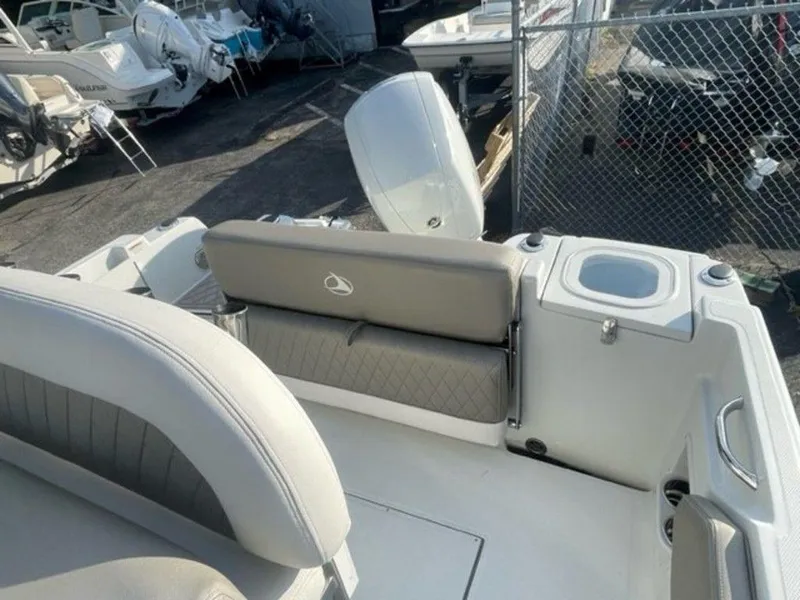 Slide: The Image of 2024 Finseeker 210 FS boat interior with seating and motor. - 6