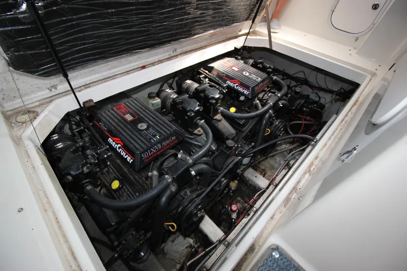 Slide: The Image of 1994 Bayliner 3055 Sunbridge engine compartment with twin MerCruiser engines. - 15