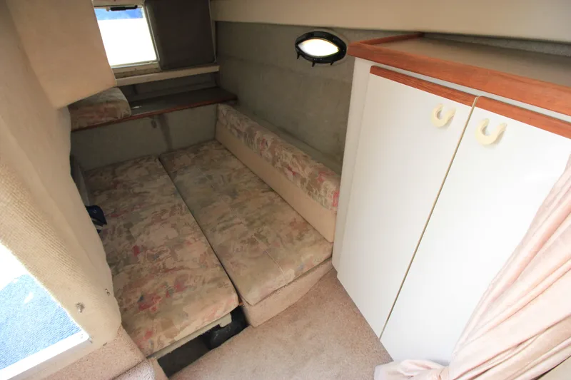 Slide: The Image of Interior cabin of 1994 Bayliner 3055 Sunbridge with seating and storage. - 21