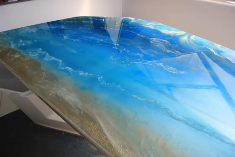 Slide: The Image of 1994 Bayliner 3055 Sunbridge boat with a stunning ocean-themed table. - 25