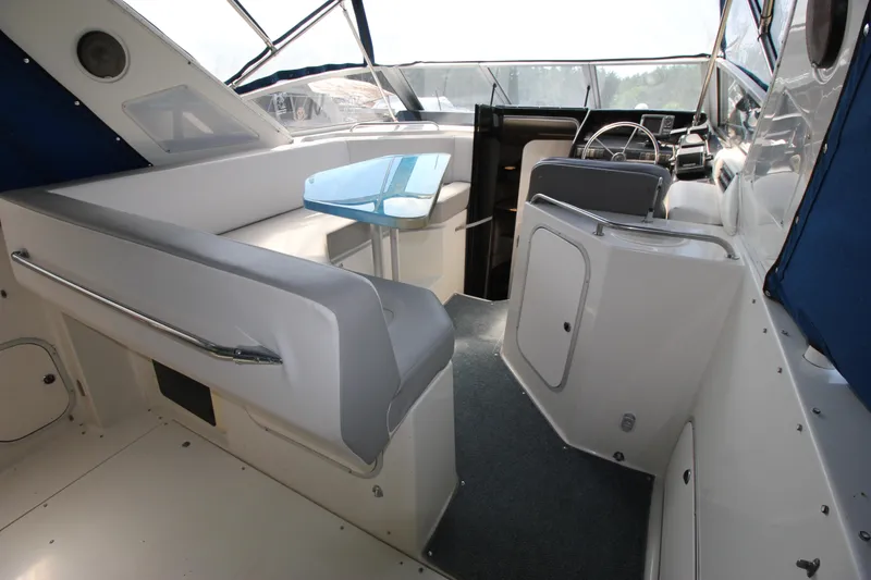 Slide: The Image of 1994 Bayliner 3055 Sunbridge interior with seating and helm. - 6