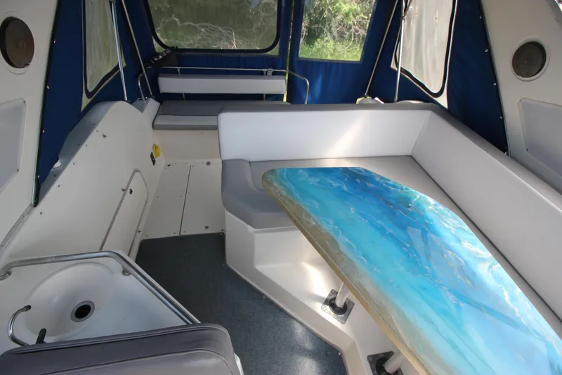 Slide: The Image of 1994 Bayliner 3055 Sunbridge interior with seating and table. - 8