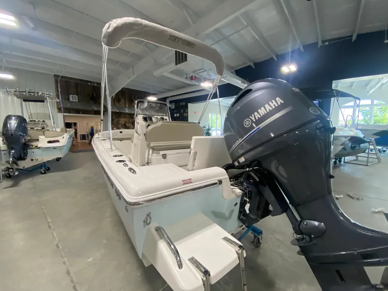 Slide: The Image of 2024 Key West 179 FS boat with Yamaha outboard motor in showroom. - 4