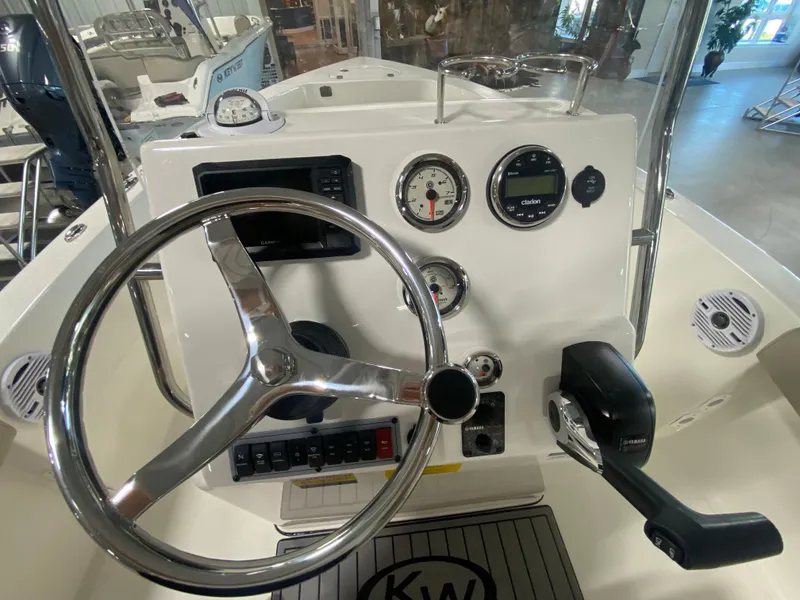 Slide: The Image of 2024 Key West 179 FS boat dashboard with steering wheel and control panel. - 10