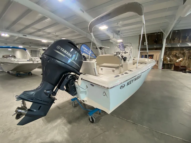 Slide: The Image of 2024 Key West 179 FS boat with Yamaha outboard motor in showroom. - 3