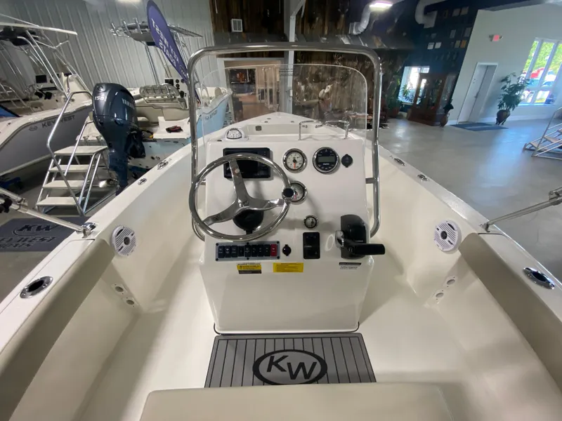 Slide: The Image of 2024 Key West 179 FS boat interior, featuring steering console and controls. - 6