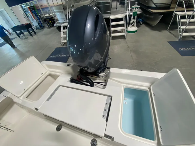 Slide: The Image of 2024 Key West 179 FS boat with outboard motor and storage compartments. - 9