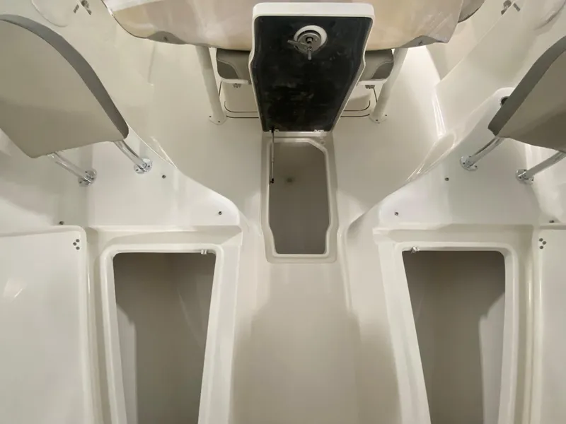 Slide: The Image of 2024 Key West 244 CC boat interior with storage compartments and seating. - 21