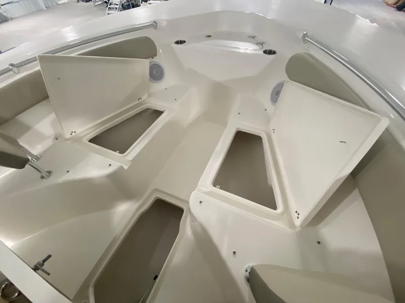 Slide: The Image of 2024 Key West 244 CC boat interior with open storage compartments. - 22