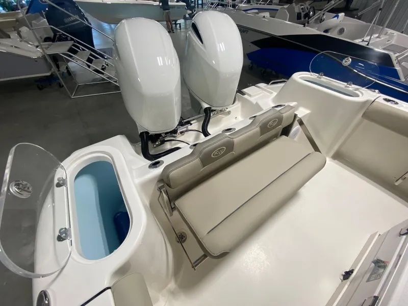 Slide: The Image of 2024 Key West 244 CC boat with twin engines and seating area. - 8