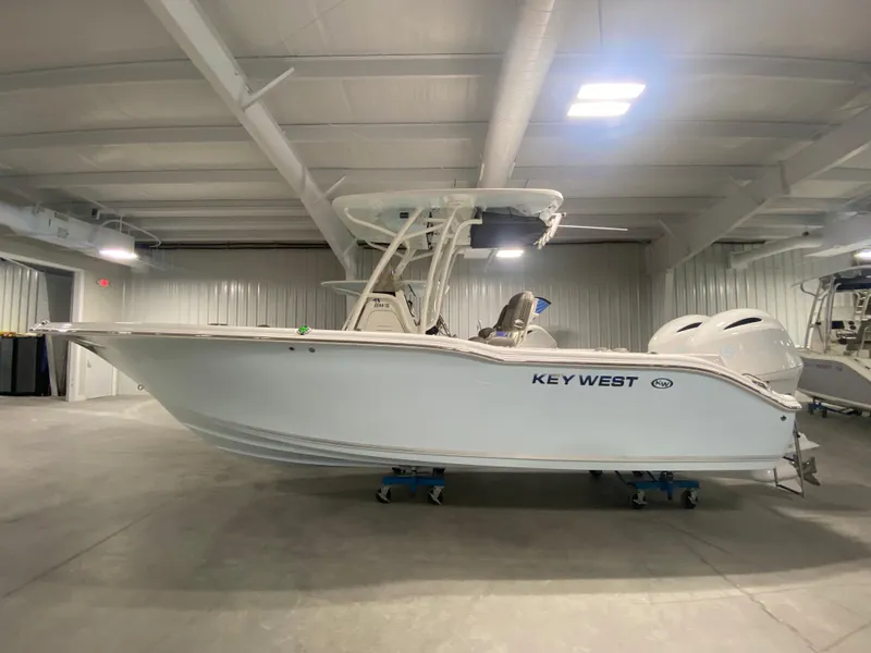 Slide: The Image of 2024 Key West 244 CC boat in indoor storage facility. - 0