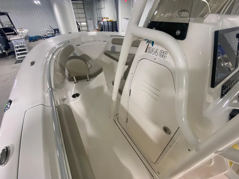 Slide: The Image of 2024 Key West 244 CC boat interior with seating and storage compartments. - 13