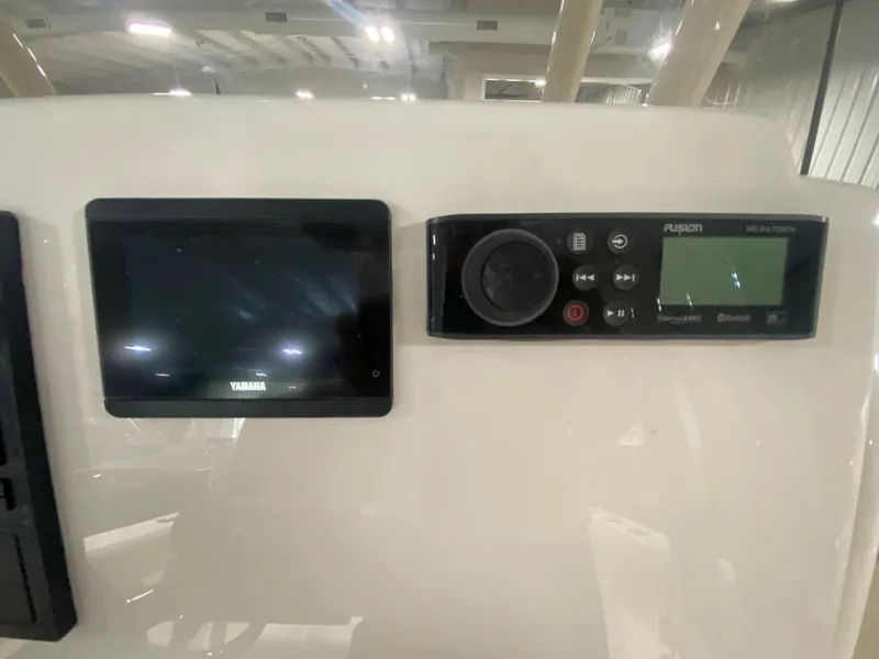 Slide: The Image of 2024 Key West 244 CC dashboard with Yamaha and Fusion displays. - 16