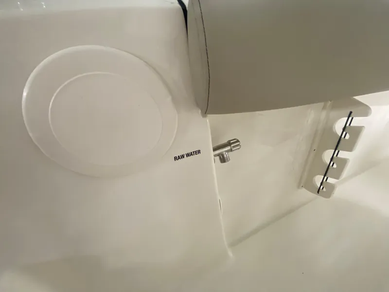 Slide: The Image of 2024 Key West 244 CC boat interior showing raw water access point. - 23