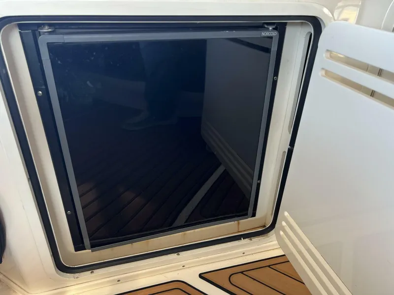 Slide: The Image of Open refrigerator on a 2001 Sea Ray 56 Sedan Bridge yacht. - 23