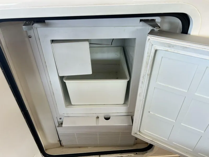 Slide: The Image of Open freezer compartment on a 2001 Sea Ray 56 Sedan Bridge yacht. - 26