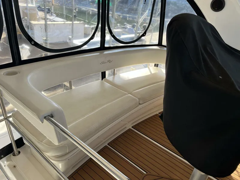 Slide: The Image of 2001 Sea Ray 56 Sedan Bridge interior seating area with panoramic windows. - 30
