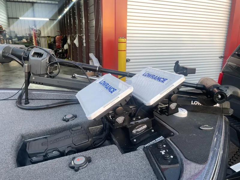 Slide: The Image of 2023 Phoenix 921 Elite II boat with Lowrance electronics in a garage. - 5