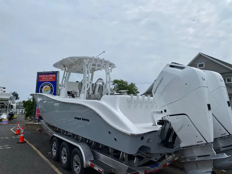 The Image of 2024 Cape Horn 34 XS boat on a trailer at a marina. - 1