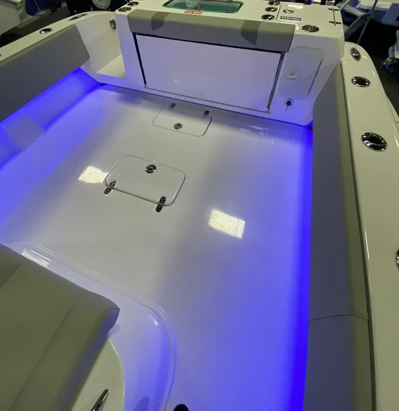 Slide: The Image of 2024 Cape Horn 34 XS boat interior with blue LED lighting. - 13