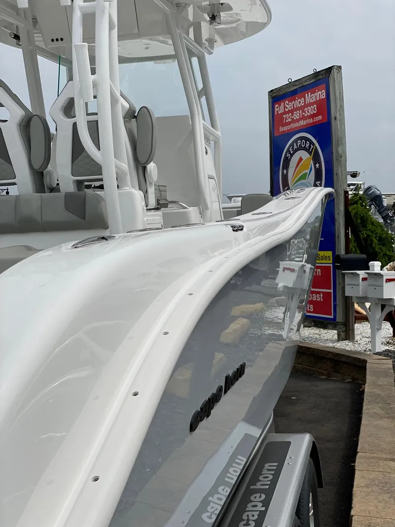 Slide: The Image of 2024 Cape Horn 34 XS boat docked at a marina. - 15