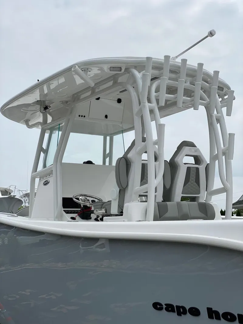 Slide: The Image of 2024 Cape Horn 34 XS boat with T-top and dual helm seats. - 16