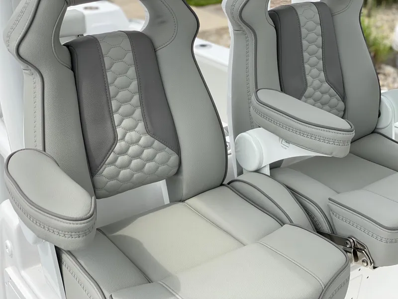 Slide: The Image of 2024 Cape Horn 34 XS boat seats with premium upholstery and armrests. - 2
