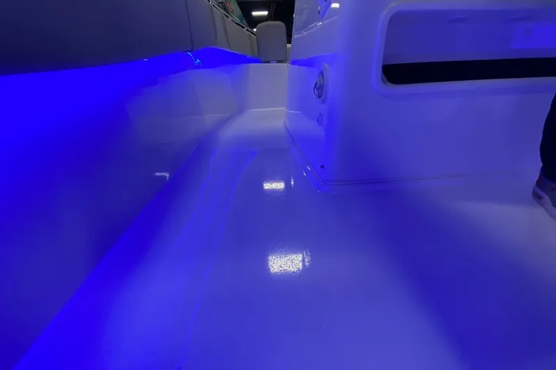 Slide: The Image of 2024 Cape Horn 34 XS boat interior with blue LED lighting. - 23