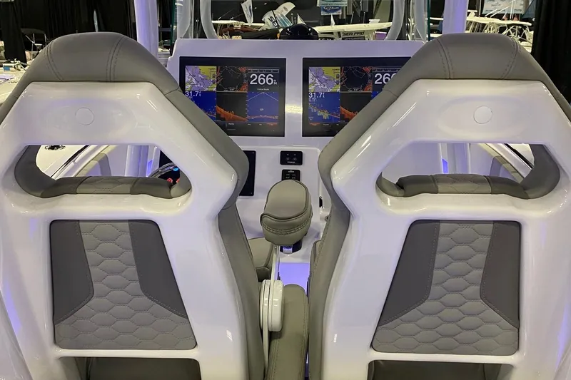 Slide: The Image of 2024 Cape Horn 34 XS boat cockpit with dual screens and modern seating. - 24