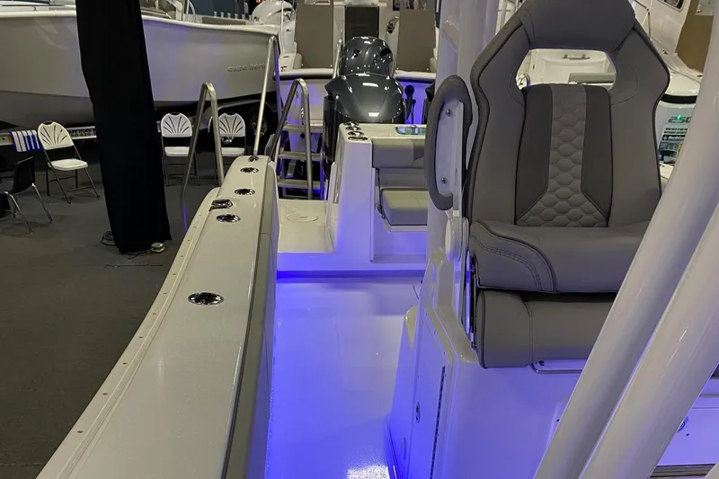 Slide: The Image of 2024 Cape Horn 34 XS boat interior with illuminated deck and seating. - 27