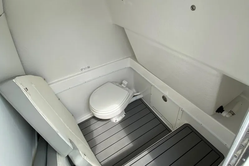Slide: The Image of 2024 Cape Horn 34 XS boat interior bathroom with toilet and seating. - 30