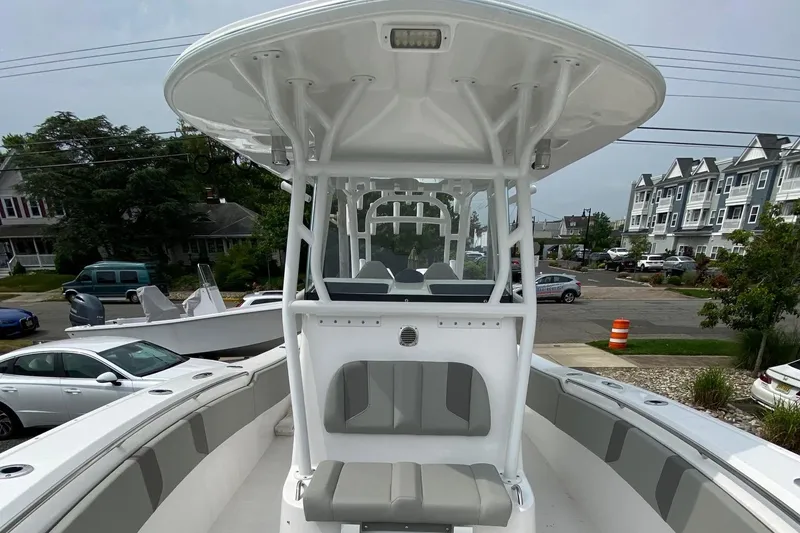 Slide: The Image of 2024 Cape Horn 34 XS boat, front view, docked in a residential area. - 31