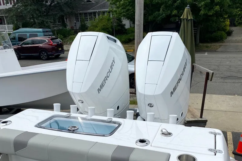 Slide: The Image of 2024 Cape Horn 34 XS boat with twin Mercury outboard engines. - 36