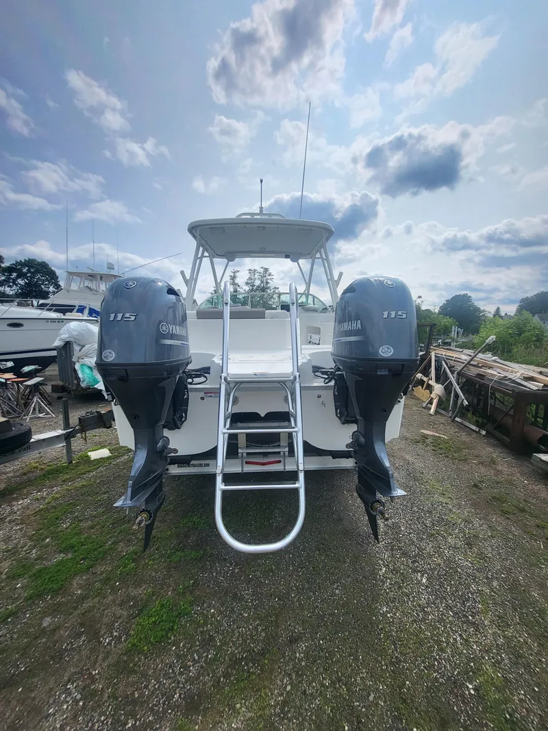 Slide: The Image of 2024 World Cat 230 SD boat with twin Yamaha 115 engines. - 2