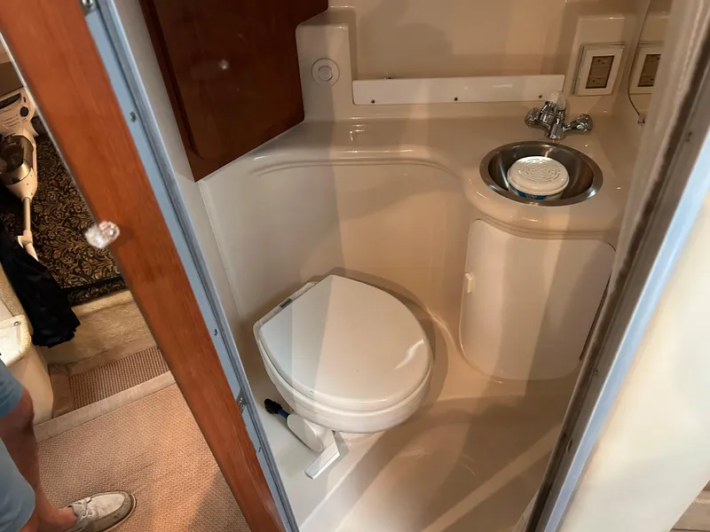 Slide: The Image of 2008 Regal 2665 Commodore boat docked in marina, front view. - 10