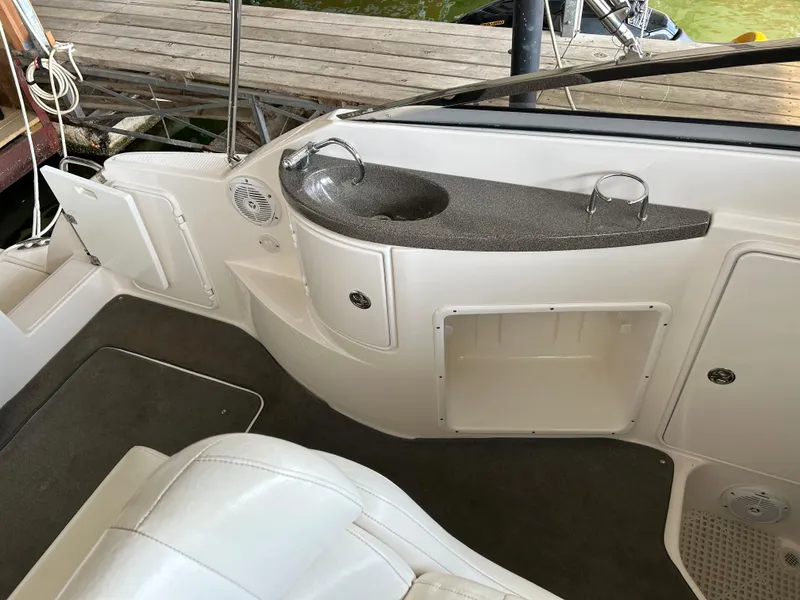 Slide: The Image of 2008 Regal 2665 Commodore engine compartment with Volvo Penta motor and battery setup. - 15