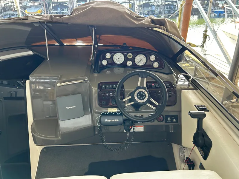 Slide: The Image of 2008 Regal 2665 Commodore kitchenette with stove, sink, microwave, and mini-fridge. - 17