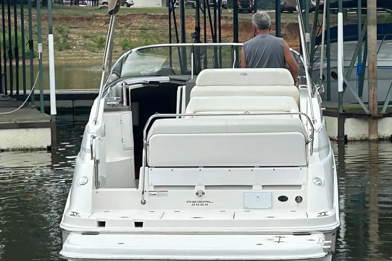 Slide: The Image of 2008 Regal 2665 Commodore boat interior with kitchenette and seating area. - 19