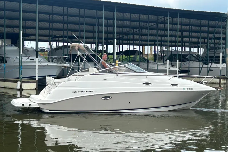 Slide: The Image of Interior of 2008 Regal 2665 Commodore boat with kitchenette and seating area. - 22