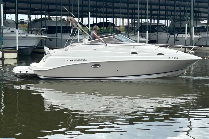 Slide: The Image of 2008 Regal 2665 Commodore boat interior with seating and storage compartments. - 23