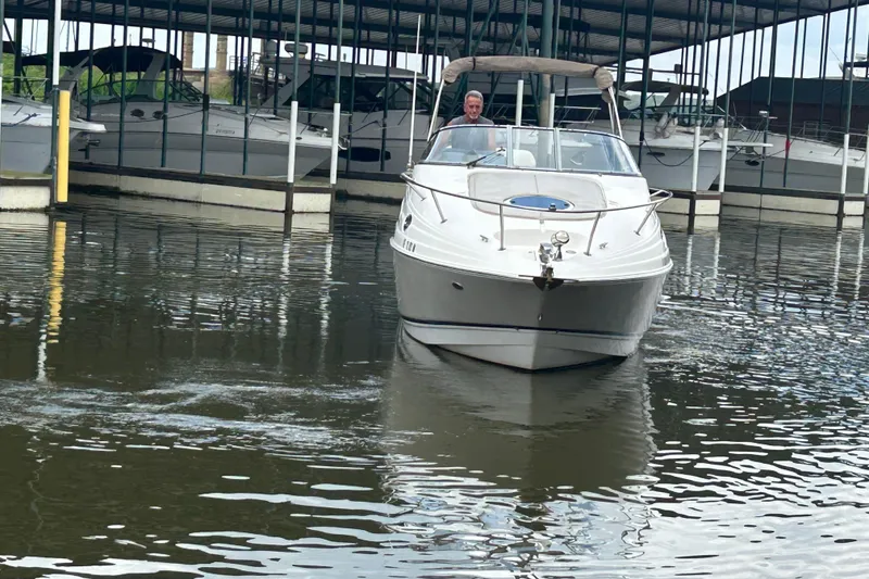 Slide: The Image of 2008 Regal 2665 Commodore boat docked in a marina, side view. - 28