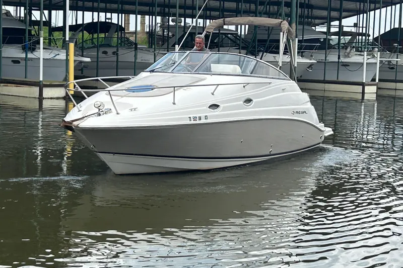 Slide: The Image of 2008 Regal 2665 Commodore boat docked in marina, rear view. - 29