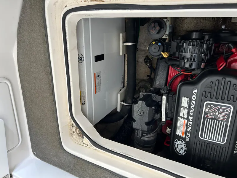 Slide: The Image of 2008 Regal 2665 Commodore boat docked at marina, side view. - 6