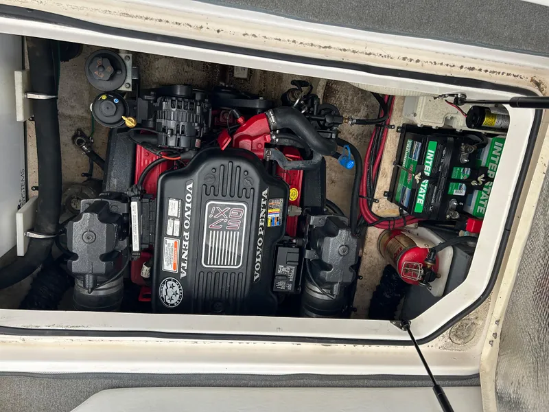 Slide: The Image of 2008 Regal 2665 Commodore boat on calm water near a marina. - 7