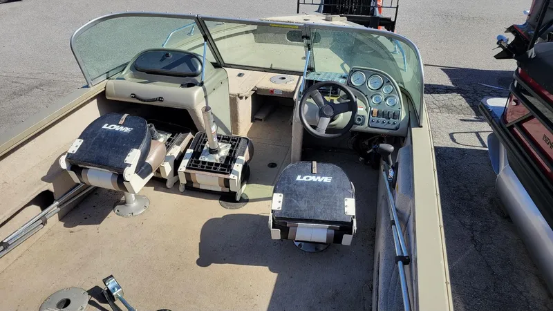 Slide: The Image of 2008 Lowe FS185 boat interior with walk-thru windshield and Mercury 150 engine. - 14