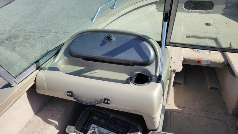 Slide: The Image of 2008 Lowe FS185 boat interior with walk-thru windshield and dashboard view. - 15