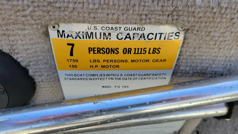 Slide: The Image of 2008 Lowe FS185 boat capacity label, 7 persons or 1115 lbs, 150 HP motor. - 18