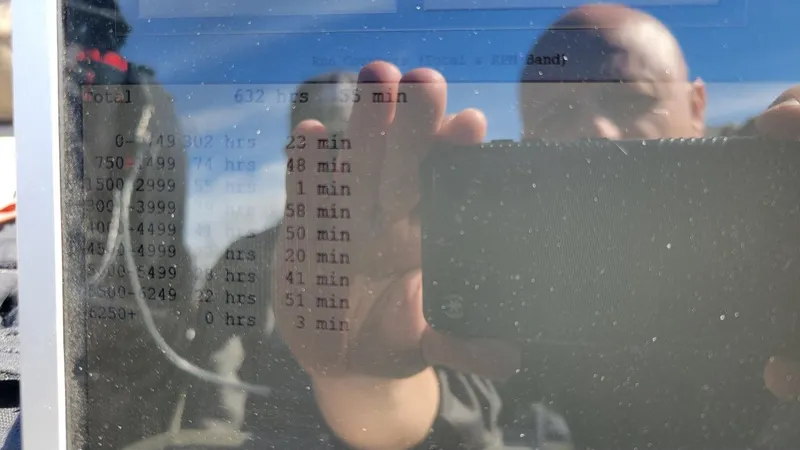 Slide: The Image of Reflection on screen showing engine hours for 2008 Lowe FS185 boat. - 2