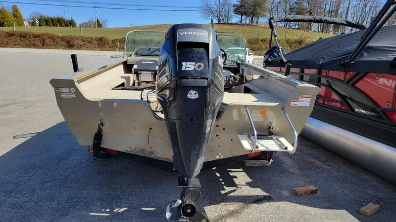 Slide: The Image of 2008 Lowe FS185 boat with Mercury 150 engine, parked outdoors. - 3