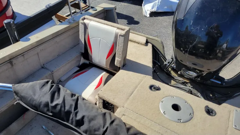 Slide: The Image of 2008 Lowe FS185 boat interior with Mercury 150 engine, featuring red-accented seats. - 8